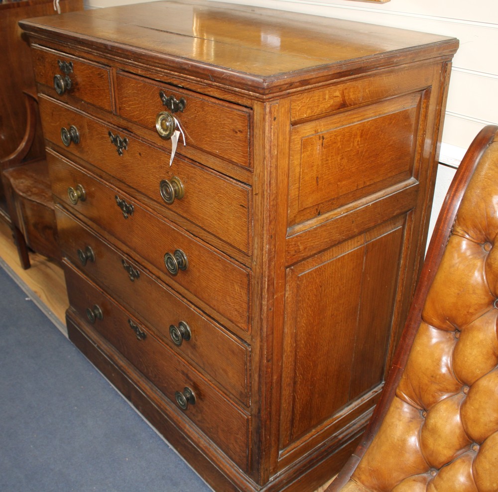 A 19th century panelled oak chest of drawers, W.103cm D.56cm H.112cm